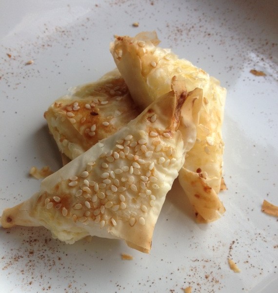 Tiropitakia | Greek feta triangles - this is a delicious recipe for wrapping feta in phyllo for an out of this world greek appetizer