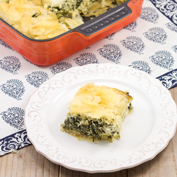 Spanakopita Recipe | The famous Greek spinach and cheese pie. A Delicious cheesy mixture wrapped in buttery flakey phyllo