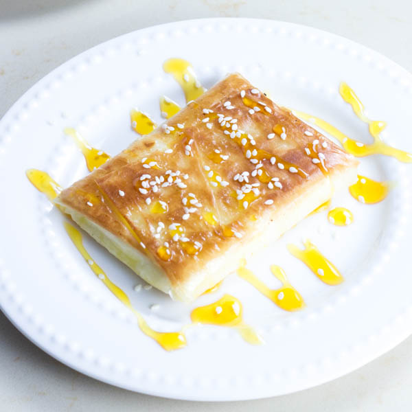 Phyllo Wrapped Feta with Honey and Sesame Seeds. This is a perfect Greek appetizer that will melt in your mouth.